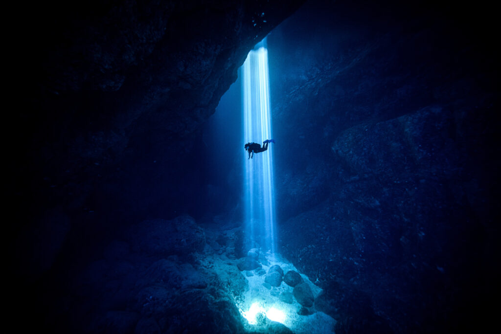 Sunlight seeping through on scuba diver